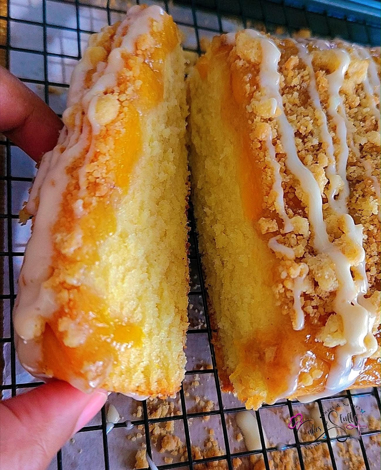 Upside down Peach cobbler loaf topped with a cinnamon streusel and cream cheese glaze